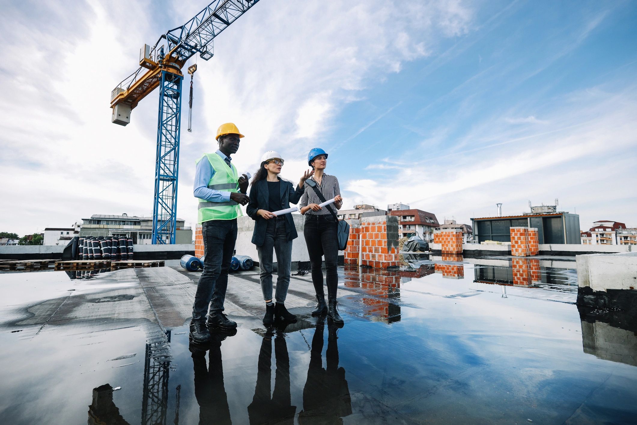 Construction team reviewing plans on site
