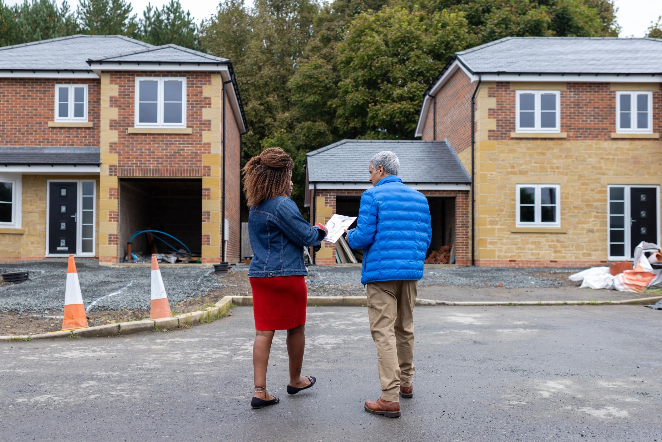 Architect discussing housing plans with a client